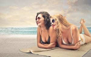 Two-women-laying-on-beach