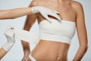 Woman with Postoperative Breast Wrap